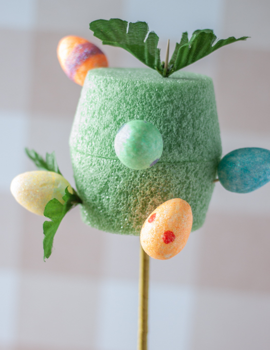 green foam pot insert with different colors of foam eggs and green leaves attached to it
