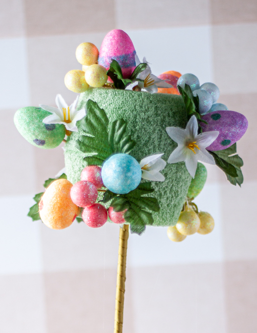 colourful eggs, leaves, and floral attached on foam green pot insert