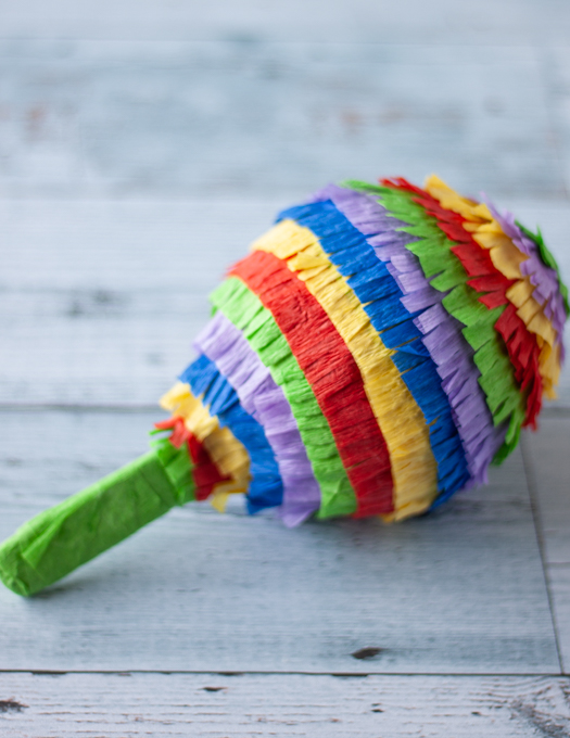 Mini Pinata fully decorated with green, red, blue and purple crepe papers