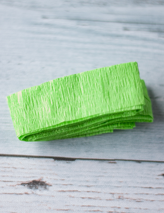 Green crepe paper wrapped into 4 inch size piece