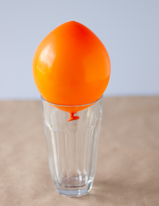 orange balloon on a glass cup