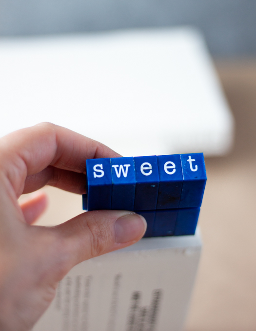 A stamp with the word sweet being stamped on a book side
